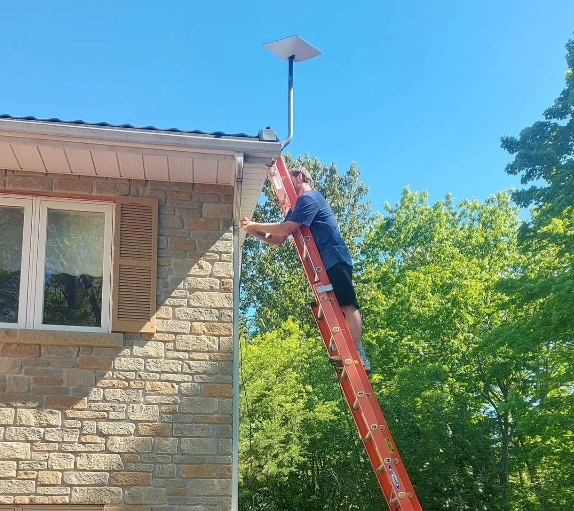 Northern Internet Solutions technician completing an outdoor installation in Northern Ontario
