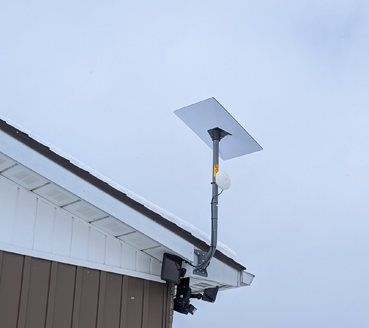 Starlink satellite dish mounted on a residential rooftop in Sudbury Ontario